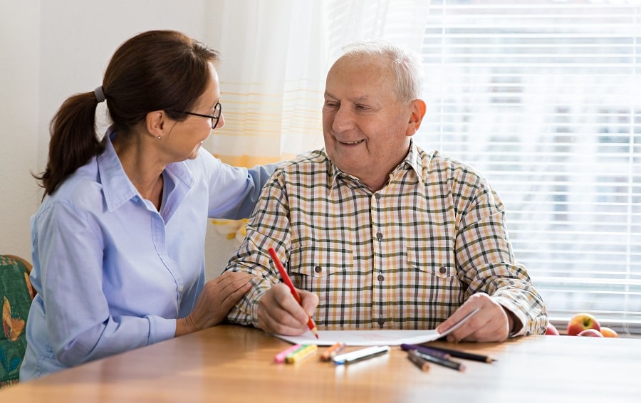 dementia-and-occupational-therapy---home-caregiver-and-senior-adult-man-926312918-5bef39d6c9e77c00517f210e-min.jpg